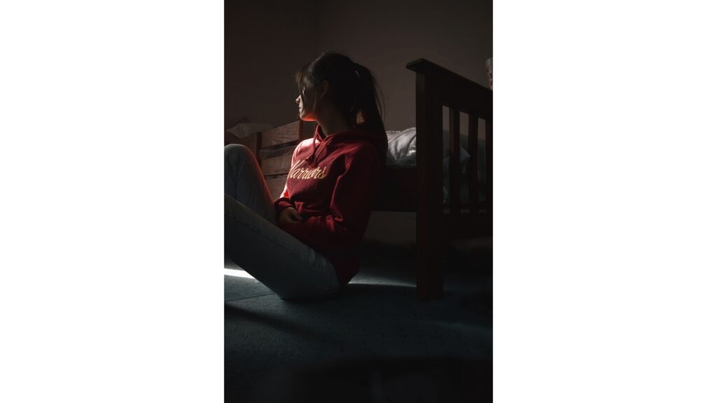 Person experiencing persistent sadness and possible depression